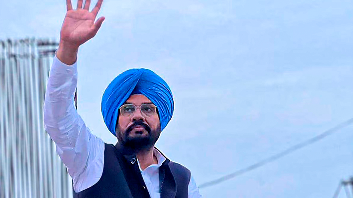 AAP Punjab leader Kuldeep Singh Dhaliwal waving to a crowd during a public address in 2026.